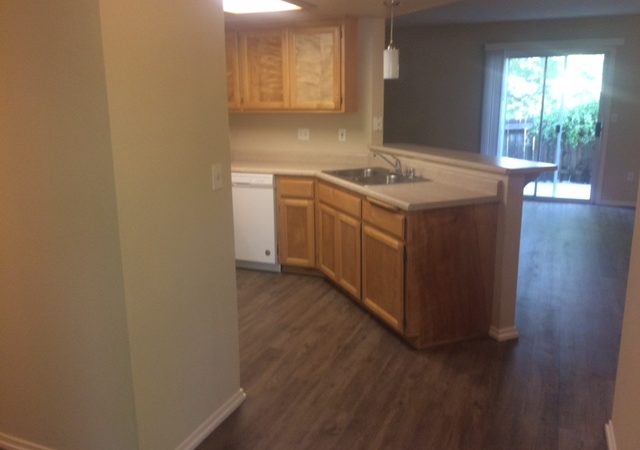picture of willow park remodeled end townhome kitchen and living room with laminate flooring