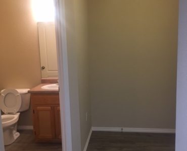 picture of willow park remodeled middle townhome half bath and entry way with laminate flooring